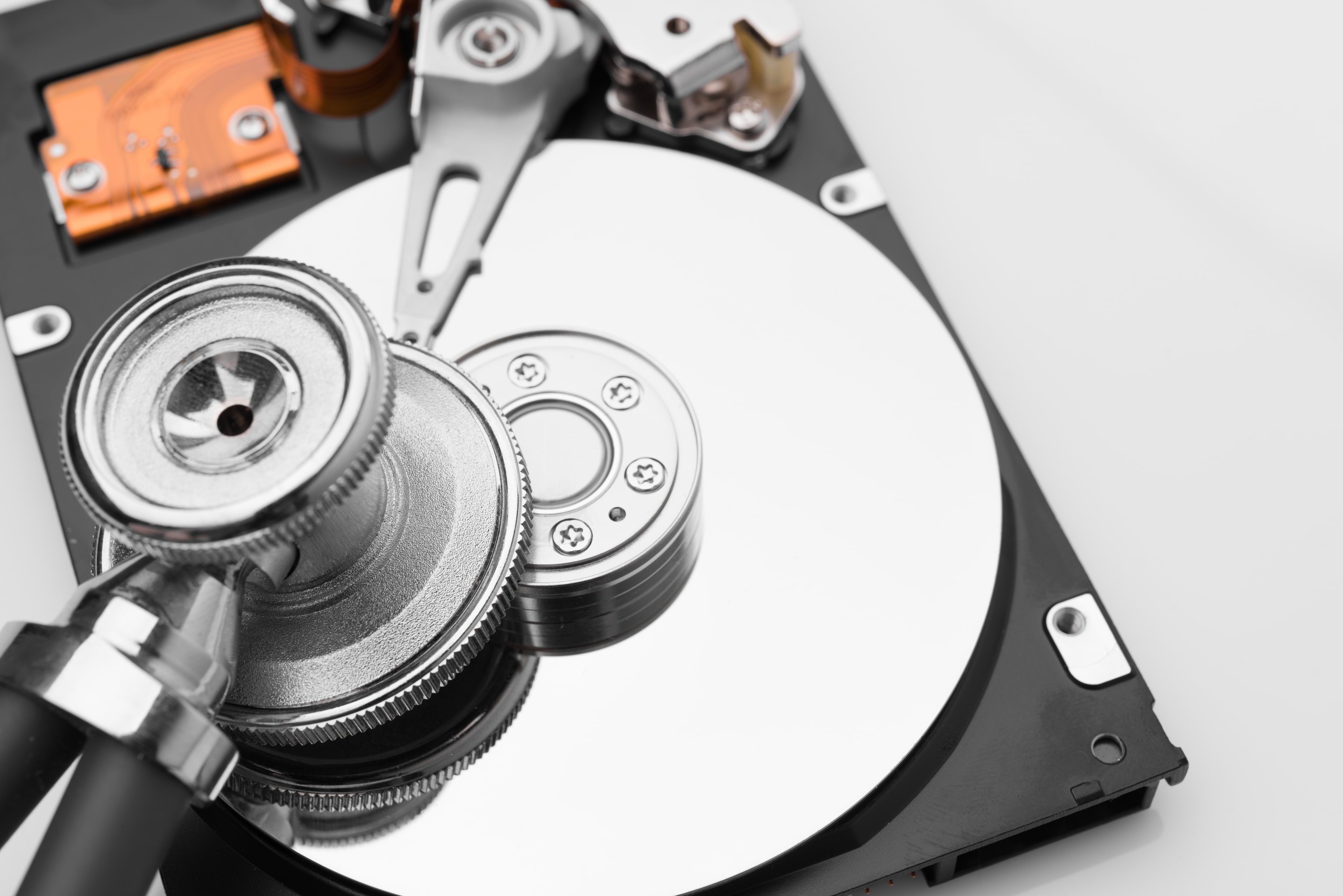 Hard drive with stethoscope — professional data diagnosis